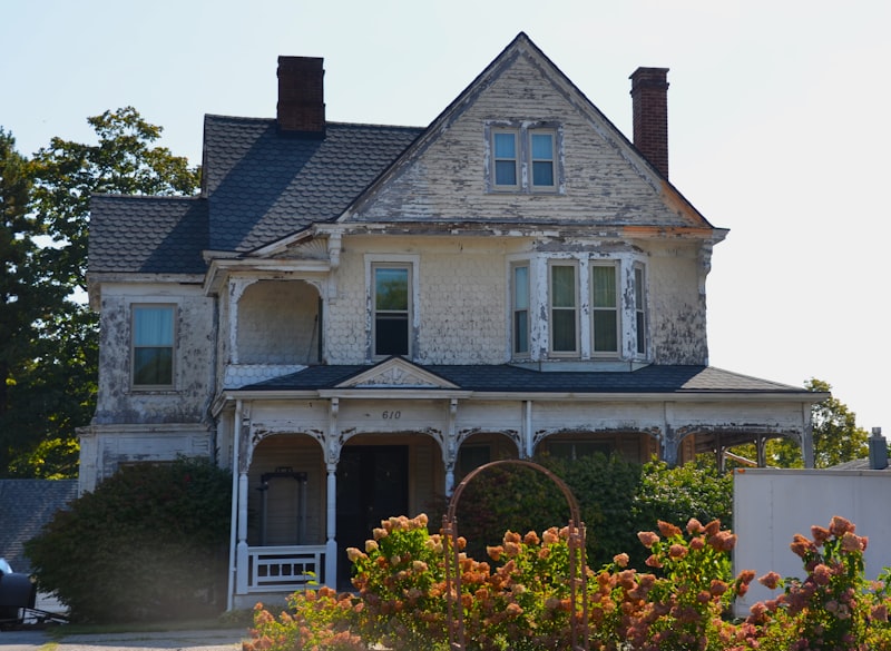 Distressed older home with peeling paint